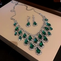 Close-up of green teardrop gemstone necklace and earring set with diamond accents - Green Water Drop Gemstone Main Stone Style / Green