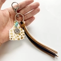 Western style cow tag keychain with turquoise beads, sunflower charm and leather fringe - White Polka Dot