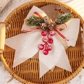 Christmas bow decoration with glitter, pine cones and red berries for tree hanging display - White