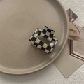 Close-up of black and white checkered square hair claw clip on a minimalist ceramic plate - Small Square Claw / Checkered