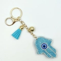 Detail of Hamsa Hand keychain with blue rhinestones, evil eye motif and soft tassel - Lake Blue