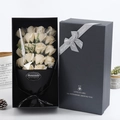 Macro shot of 18 off-white soap roses in a black gift box with grey ribbon detail - 18 Pcs/Black Box / Champagne