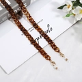 Detail of amber tortoiseshell acrylic chain with golden lobster clasps and silicone loops - Amber (D4421)