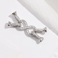 Macro shot of silver 8-shape jewelry clasp connector with sparkling cubic zirconia inlay - VK278 Silver White Zircon 4-Leg Infinity Clasp