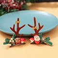 Christmas hair clips set featuring brown reindeer antlers and green bows on blue plate - Christmas Clip Style 1