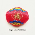 Detail of red satin Fu character embroidery patch with gold thread and blue clouds decor - Lantern
