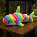 Plush shark toy with colorful rainbow stripes and white belly on a wooden table - 30cm / Rainbow Stripes