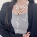Multilayer pearl necklace featuring a vintage gold cupid pendant and drop pearl - Vintage Multi-Layer Angel Pendant Pearl Necklace (X4634A) / Gold White