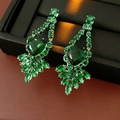 Macro shot of luxury emerald heart and marquise cut zircon drop earrings set - Silver Needle Studs / Green