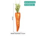 Carrot-shaped painted glass ornament with green glitter leaves and orange textured finish - Radish Ornament