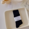 Breathable black crew socks with vertical stripes in minimalist cotton packaging - Black
