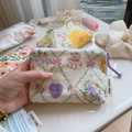 Hand holding floral cotton coin purse with zipper and cute patterns for storage - Light Purple Heart Bear Girl