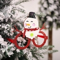 Occhiali natalizi rossi glitterati con pupazzo di neve appesi a un ramo - Stile Pupazzo di Neve di Natale