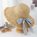 Beige raffia sun hat with raw fringe edges and light blue floral ribbon decoration - Blue Ribbon Style