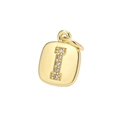 Macro shot of gold-plated square pendant with zircon letter I inlay on white background - Letter I