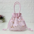 Pink drawstring bucket bag with elegant floral embroidery and satin finish - Deep Pink