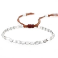Pulsera tejida a mano con cuentas de cobre plateado y borlas ajustables - Cobre Bañado en Plata