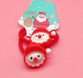 Christmas hair ties set with cute Santa Claus charms on green card packaging - Santa Claus Decor