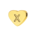 Detailed view of heart-shaped gold-plated bead with embossed letter X on mirror surface - Letter X