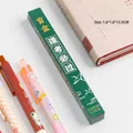 Scatola a sorpresa natalizia con una penna gel a scatto verde scuro casuale per bambini - Successo agli esami