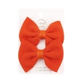 Set of two bright orange waffle textured bow hair clips on a white display card - Orange