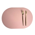 Oval pink leather placemat with elegant golden cutlery on white background - Pink + Dark Grey