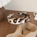Handmade leopard print headband with soft fabric texture on a warm wooden surface - Large Leopard Beige Gray