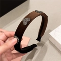 Detail of dark brown velvet headband featuring sparkling rhinestone heart ornaments - Coffee