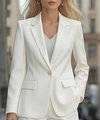 Detailed close-up of a white blazer featuring a gold single button and flap pockets - S / Tops / White