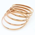 Set of five minimalist rose gold plated stainless steel bangles with a high-polished finish - Inner Diameter 55mm / Rose Gold (5 Rings)