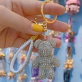 Silver rhinestone bear keychain with gold clasp and white diamond leather hand strap - White