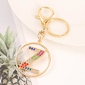 Macro detail of golden metal keychain with letter Z and colorful rhinestones - Letter Z