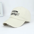 Close-up detail of a retro washed cotton baseball cap with embroidered lettering - Letter Embroidery Distressed Style / Off White