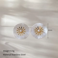Detail of 42mm flower stud earrings showing stainless steel material and pearl center - White