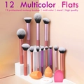 Close-up of 12 professional makeup brushes with pink handles on a white display stand - 12 Pcs Multicolor + 3 Puffs + Brush Egg