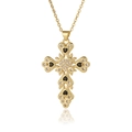 Detailed view of a gold cross pendant necklace featuring black heart stones and clear zircons - Black