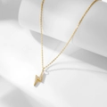 Macro detail of gold S925 sterling silver lightning bolt pendant with sparkling zircons - 925 Silver / Gold
