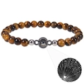 Macro detail of Tiger Eye beaded bracelet with 100 languages projection stone - Round-Tiger Eye
