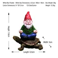 Garden gnome statue sitting on a turtle figurine made of resin for outdoor decoration - Zen Gnome on Turtle