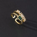 Macro detail of emerald-cut green stone and zircon inlay on a gold double-layer open ring - Double Layer Rectangle Green Gem Style