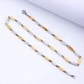 Dettaglio della collana bicolore in acciaio inossidabile con maglie geometriche a barre - 60CM / Oro e Argento