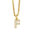 Detailed macro view of gold-plated letter F pendant encrusted with white cubic zirconia stones - Letter F / Gold