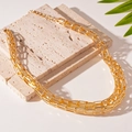 Detail of multilayer gold chain necklace on stone plate with aesthetic green leaf decor - 59# Necklace - Gold - Braided Bold Chain