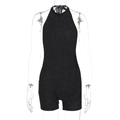 Detail of black glitter backless halter romper showing shiny fabric and sexy slim fit style - S / Black