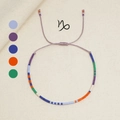 Handgefertigtes Steinbock-Sternzeichen-Armband mit bunten Perlen und lila Kordel - Steinbock (MI-Serie)