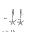 Detail van zilveren zeester oorbellen met zirkonia afmetingen en een lengte van 29 mm - Zilveren Zeester Stijl (TE6529-S)