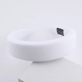 White padded milk silk sponge headband with handmade label on minimalist stand - White