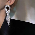 Macro view of long silver tassel earrings with sparkling rhinestones and ribbon design - Ribbon Twist Rhinestone Tassel Style (4#银针-银色)