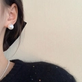 Elegant white round pearl stud earring for women shown on model for a minimalist style - Shell Pearl No. 12
