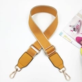 Detail of yellow woven bag strap with PU leather ends and adjustable gold hardware - Yellow & Yellow
